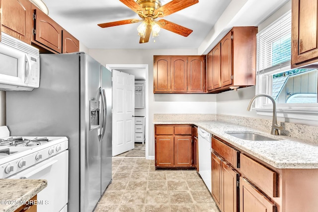 137 Seabreeze Way, Keansburg, NJ 07734 - kitchen with white appliances, ceiling fan, and brown cabinets