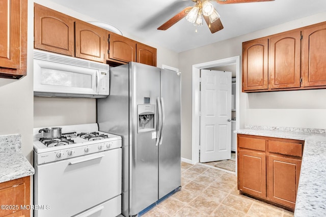 137 Seabreeze Way, Keansburg, NJ 07734 - kitchen with white appliances, a ceiling fan, and brown cabinets