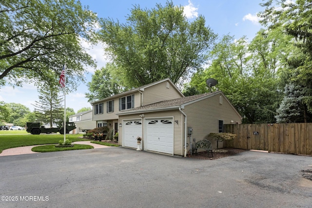 280 Double Creek Pkwy, Freehold, NJ 07728 - view of front facade featuring asphalt driveway and an attached garage