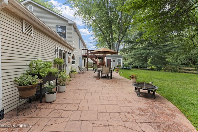 280 Double Creek Pkwy, Freehold, NJ 07728 - view of patio / terrace featuring outdoor dining space, a fire pit, and a storage unit