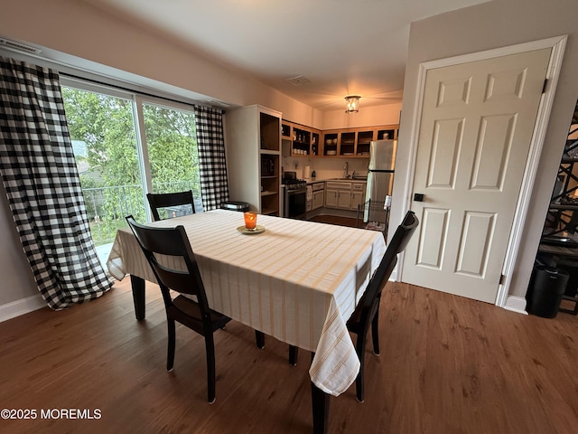 4 Nebraska Dr Unit C, Matawan, NJ 07747 - dining area featuring baseboards and dark wood-type flooring