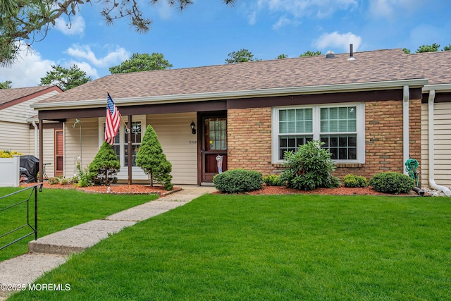 530B Sheffield Dr, Manchester, NJ 08759 - single story home featuring brick siding, a front yard, a shingled roof, and a porch