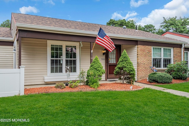 530B Sheffield Dr, Manchester, NJ 08759 - view of front of property with a front yard, roof with shingles, brick siding, and a porch