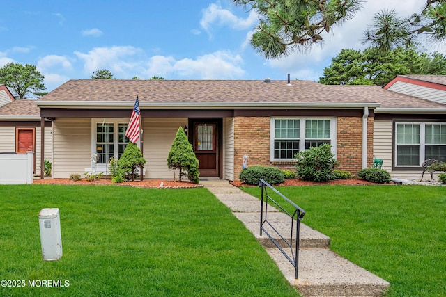 530B Sheffield Dr, Manchester, NJ 08759 - ranch-style home with a front lawn, brick siding, a shingled roof, and covered porch