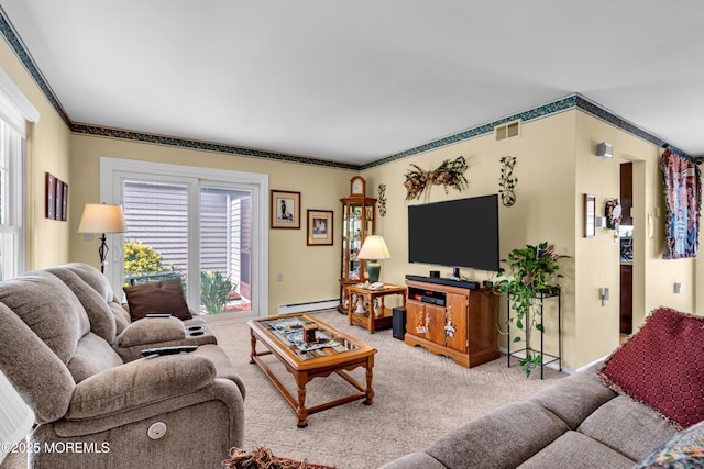 530B Sheffield Dr, Manchester, NJ 08759 - carpeted living room featuring a baseboard radiator and ornamental molding