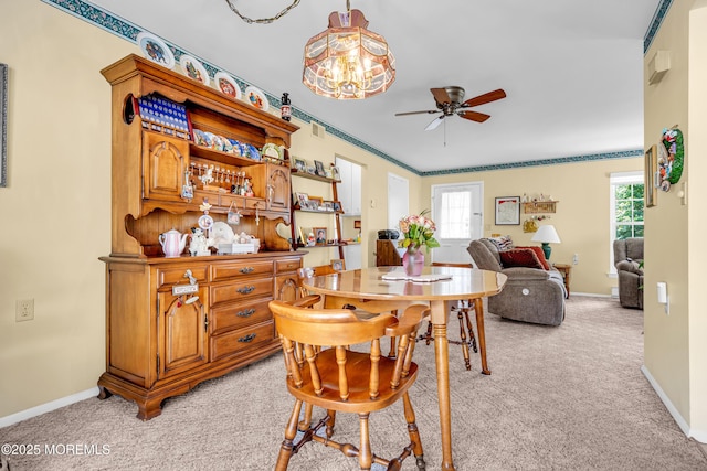 530B Sheffield Dr, Manchester, NJ 08759 - dining area with light colored carpet, a ceiling fan, and plenty of natural light