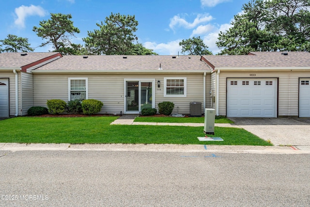530B Sheffield Dr, Manchester, NJ 08759 - view of front of home featuring a front yard, driveway, an attached garage, and a shingled roof