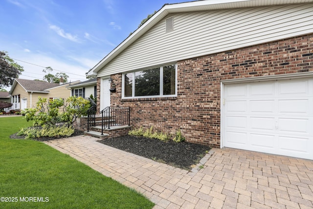 811 Fay Ct, Point Pleasant, NJ 08742 - ranch-style home featuring brick siding, a front lawn, decorative driveway, and a garage