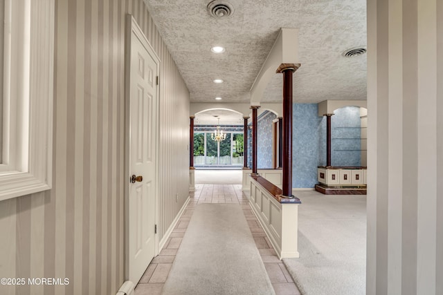811 Fay Ct, Point Pleasant, NJ 08742 - hallway with a chandelier, wallpapered walls, baseboard heating, recessed lighting, and decorative columns