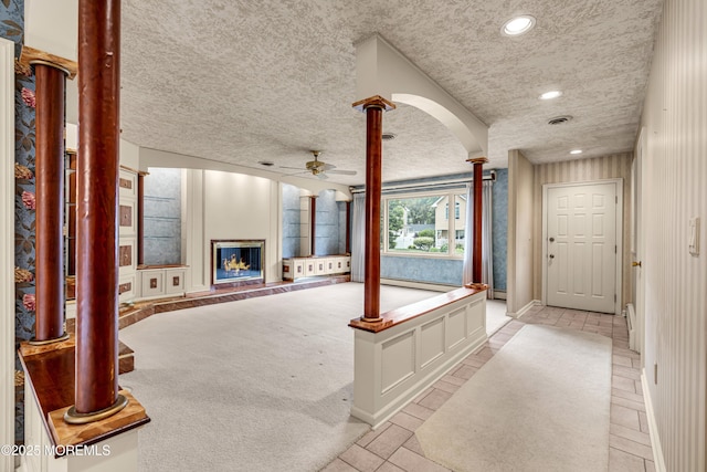 811 Fay Ct, Point Pleasant, NJ 08742 - foyer with ceiling fan, recessed lighting, decorative columns, a glass covered fireplace, and a baseboard radiator