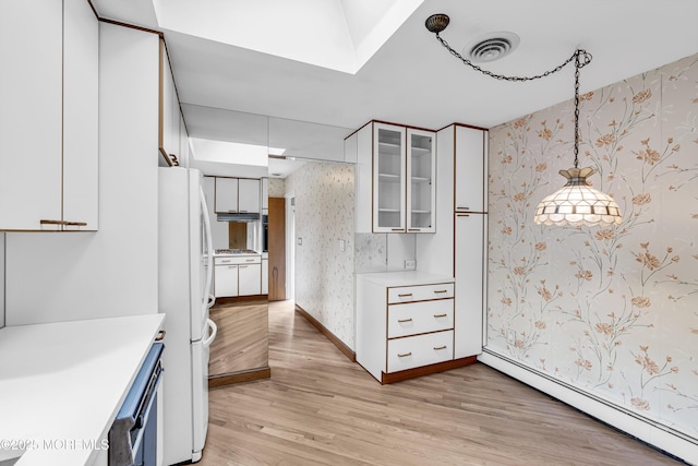 811 Fay Ct, Point Pleasant, NJ 08742 - kitchen featuring a baseboard heating unit, wallpapered walls, freestanding refrigerator, light countertops, and light wood finished floors