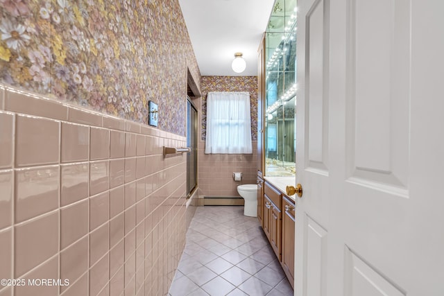 811 Fay Ct, Point Pleasant, NJ 08742 - full bathroom featuring tile patterned floors, vanity, wallpapered walls, tile walls, and a baseboard heating unit