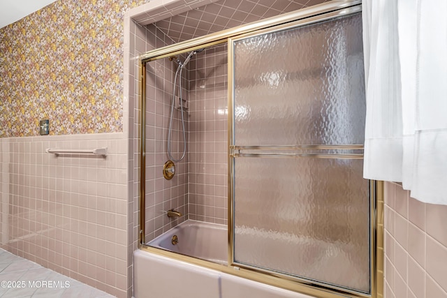 811 Fay Ct, Point Pleasant, NJ 08742 - full bathroom with tile walls, shower / bath combination with glass door, wainscoting, and wallpapered walls