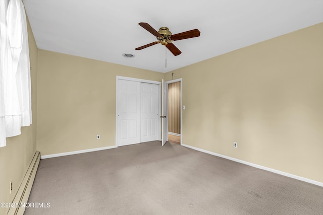 811 Fay Ct, Point Pleasant, NJ 08742 - unfurnished bedroom with baseboard heating, a closet, carpet, and ceiling fan