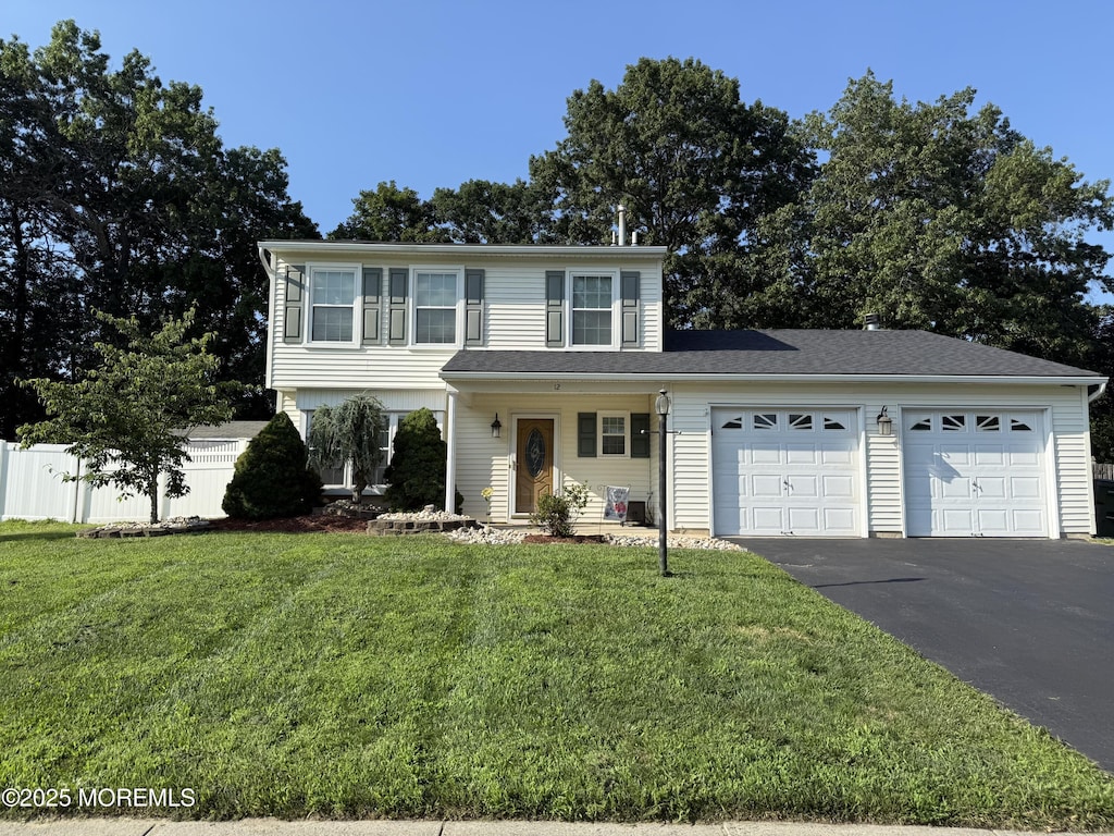 12 Quailtree Ln, Howell, NJ 07731 - view of front of property with asphalt driveway and an attached garage
