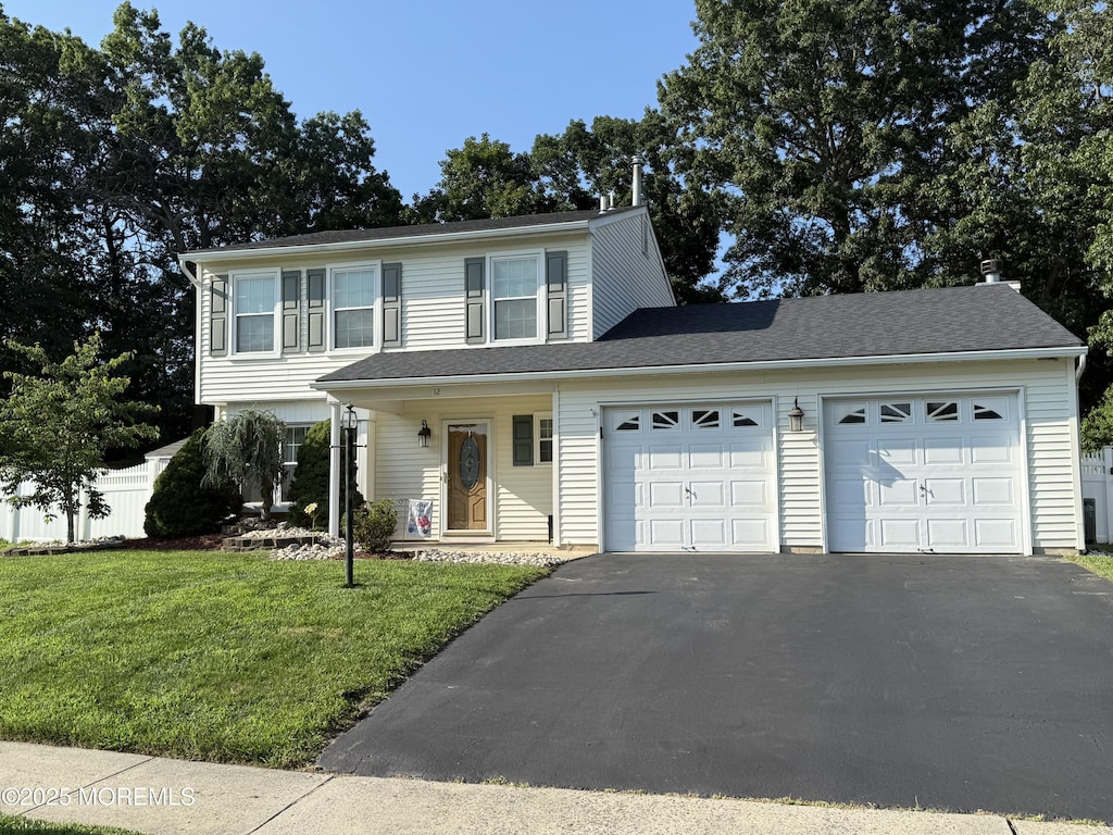 12 Quailtree Ln, Howell, NJ 07731 - view of front facade featuring asphalt driveway and a garage