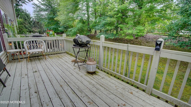 56 W Aspen Way, Aberdeen, NJ 07747 - wooden deck with view of scattered trees and a lawn