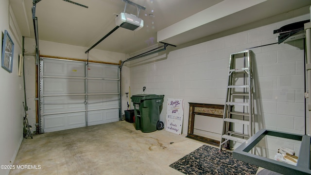 56 W Aspen Way, Aberdeen, NJ 07747 - garage with a garage door opener and concrete block wall
