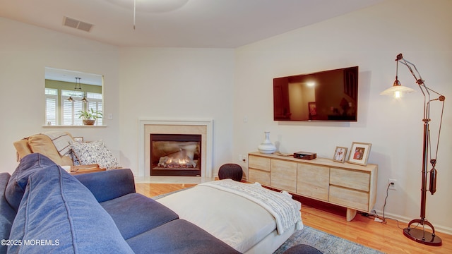 56 W Aspen Way, Aberdeen, NJ 07747 - living room featuring light wood-style flooring and a high end fireplace