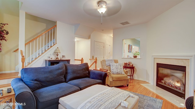 56 W Aspen Way, Aberdeen, NJ 07747 - living area featuring light wood-style flooring, ceiling fan, stairs, and a fireplace