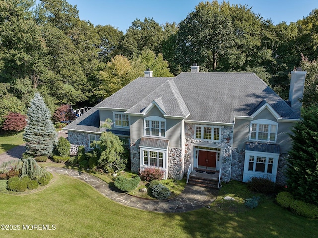 26 Bruns Rd, Allenhurst, NJ 07711 - shingle-style home featuring stone siding, a chimney, and a front yard