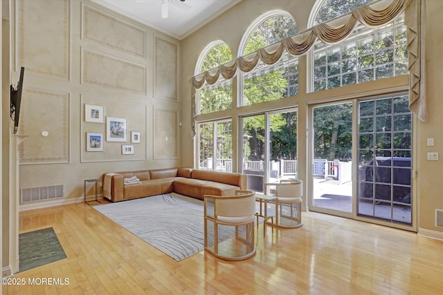 26 Bruns Rd, Allenhurst, NJ 07711 - living room featuring a high ceiling, hardwood / wood-style flooring, ceiling fan, and crown molding