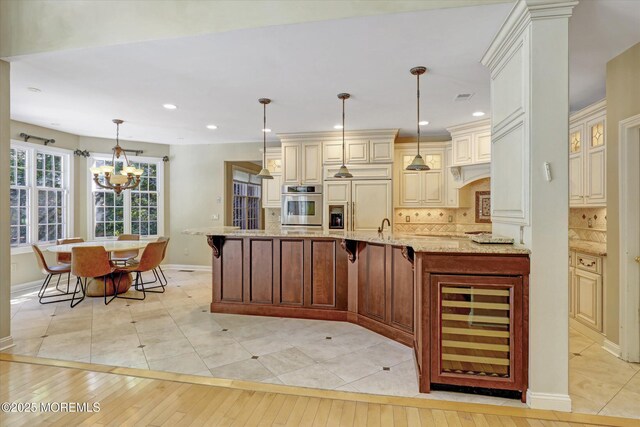 26 Bruns Rd, Allenhurst, NJ 07711 - kitchen featuring oven, wine cooler, paneled built in fridge, light stone counters, and backsplash