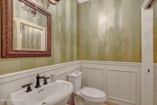 26 Bruns Rd, Allenhurst, NJ 07711 - half bath featuring wallpapered walls, a decorative wall, and wainscoting