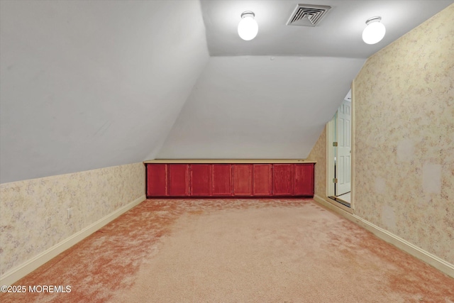 26 Bruns Rd, Allenhurst, NJ 07711 - additional living space featuring wallpapered walls, vaulted ceiling, and light colored carpet