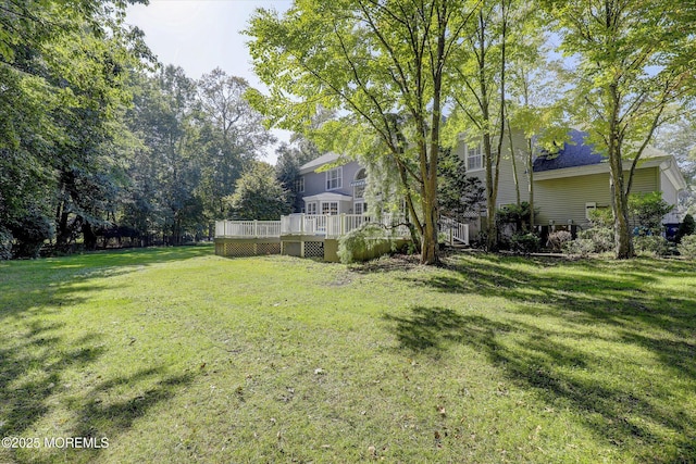 26 Bruns Rd, Allenhurst, NJ 07711 - view of green lawn with a deck