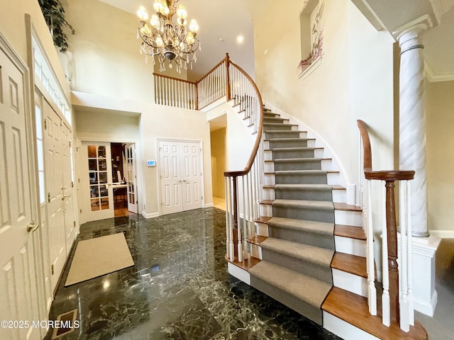 26 Bruns Rd, Allenhurst, NJ 07711 - entrance foyer featuring marble tiled flooring, stairway, a towering ceiling, and a chandelier