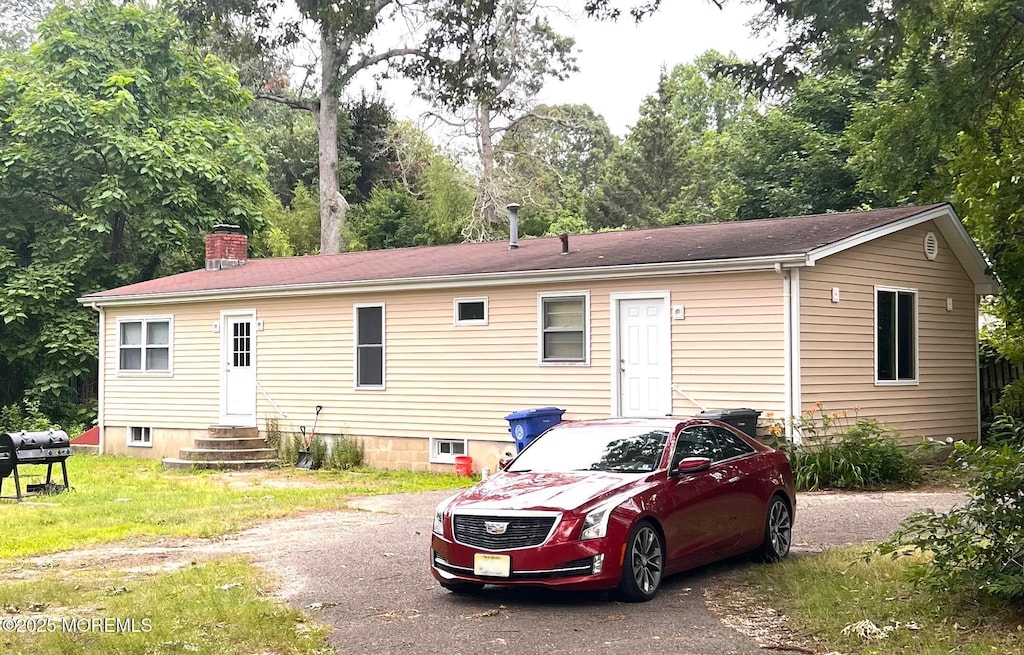 179 Maple Ave, Island Heights, NJ 08732 - rear view of house with entry steps and a chimney