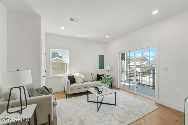 5 Shore Pine Dr, Brick, NJ 08723 - living room featuring healthy amount of natural light, light wood-style floors, electric panel, and recessed lighting