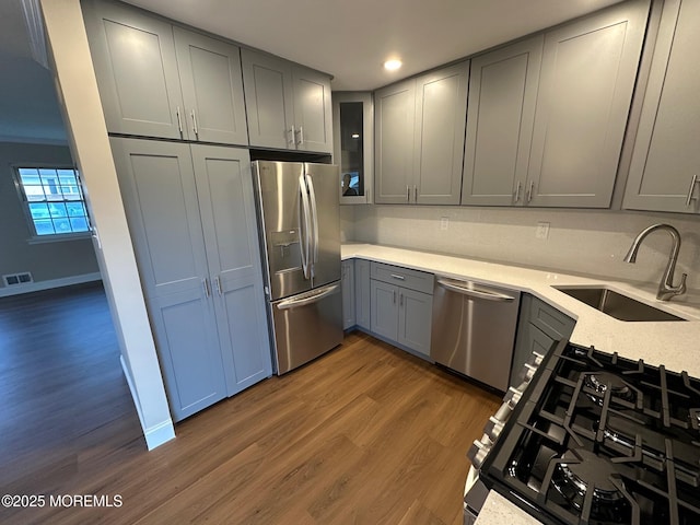 8 Missouri Ct, Matawan, NJ 07747 - kitchen featuring stainless steel appliances, gray cabinets, dark wood-style floors, and recessed lighting