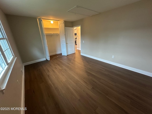 8 Missouri Ct, Matawan, NJ 07747 - unfurnished bedroom with attic access, dark wood-style flooring, and a closet