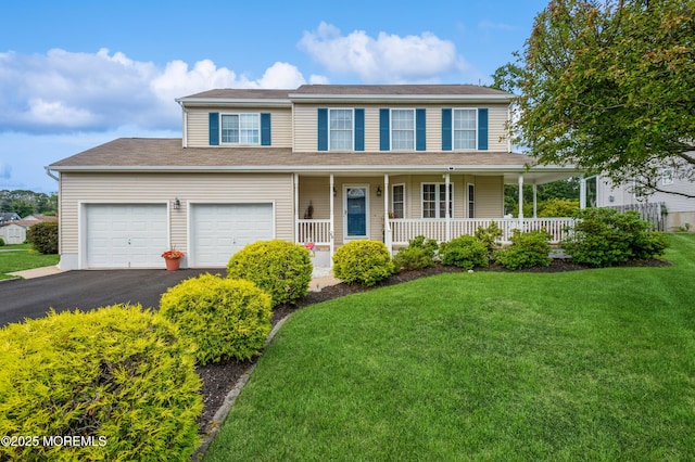 12 Aarons Way, Brick, NJ 08723 - view of front of house with a porch, a front lawn, and driveway