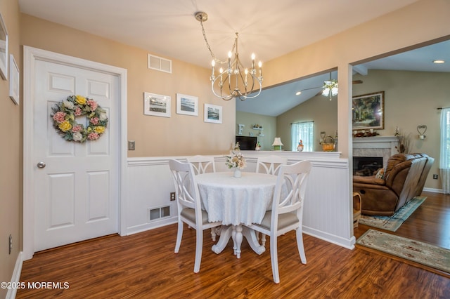 12 Aarons Way, Brick, NJ 08723 - dining room with wood finished floors, wainscoting, a ceiling fan, vaulted ceiling, and a chandelier