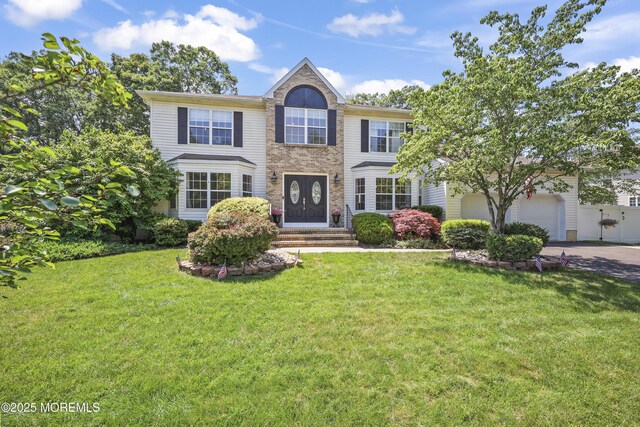 304 Mackenzie Dr, Jackson, NJ 08527 - view of front facade with concrete driveway and a front yard