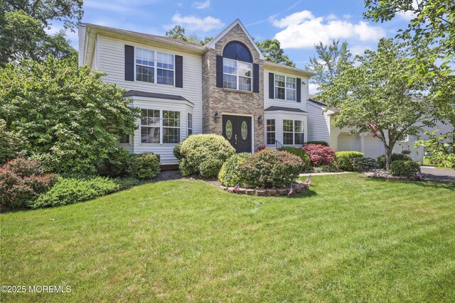 304 Mackenzie Dr, Jackson, NJ 08527 - view of front of home featuring a front yard and a garage