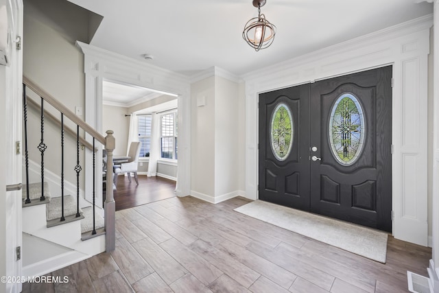 304 Mackenzie Dr, Jackson, NJ 08527 - foyer entrance with stairway, ornamental molding, wood finished floors, and a chandelier