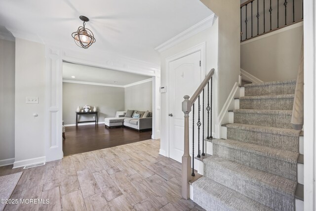304 Mackenzie Dr, Jackson, NJ 08527 - stairway with crown molding and wood finished floors