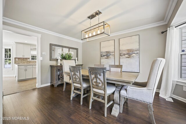 304 Mackenzie Dr, Jackson, NJ 08527 - dining area with dark wood-style floors, ornamental molding, and a chandelier