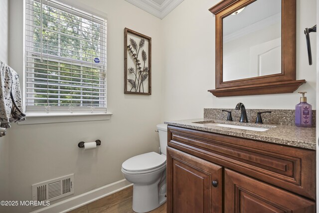 304 Mackenzie Dr, Jackson, NJ 08527 - half bathroom with vanity, ornamental molding, and wood finished floors
