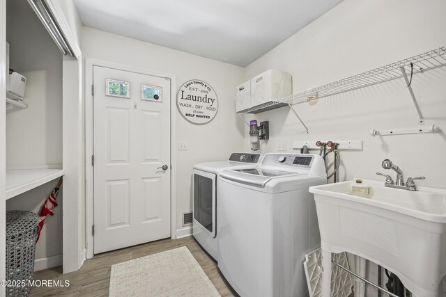 304 Mackenzie Dr, Jackson, NJ 08527 - laundry area with washing machine and clothes dryer and light wood-style floors