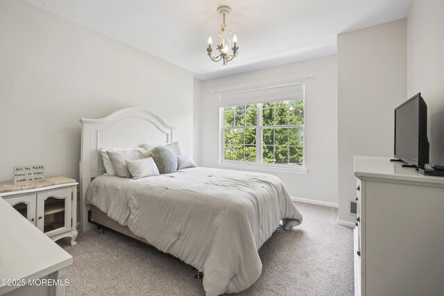 304 Mackenzie Dr, Jackson, NJ 08527 - bedroom featuring a chandelier and light colored carpet