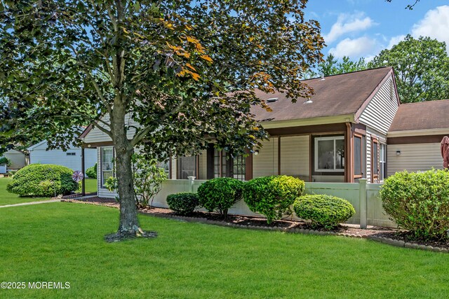 853 Winchester Ct Unit A, Manchester, NJ 08759 - obstructed view of property featuring a front yard and a shingled roof