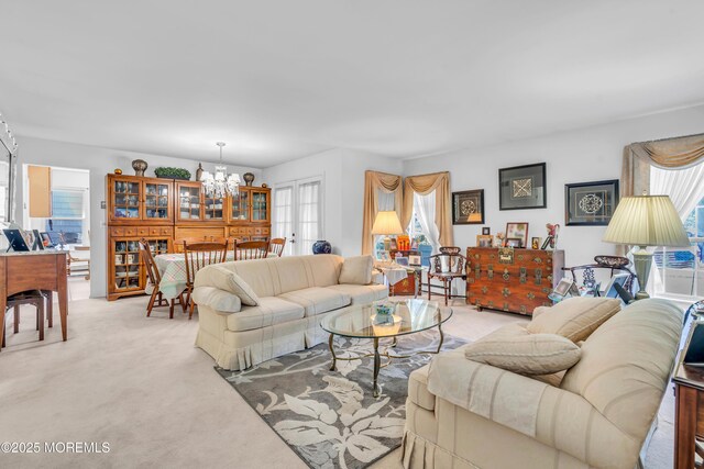 853 Winchester Ct Unit A, Manchester, NJ 08759 - living room with a chandelier and light carpet