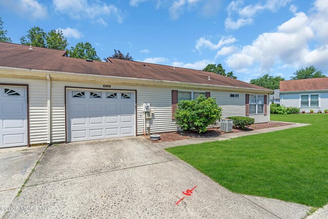 853 Winchester Ct Unit A, Manchester, NJ 08759 - view of front of home featuring driveway, a front lawn, and an attached garage