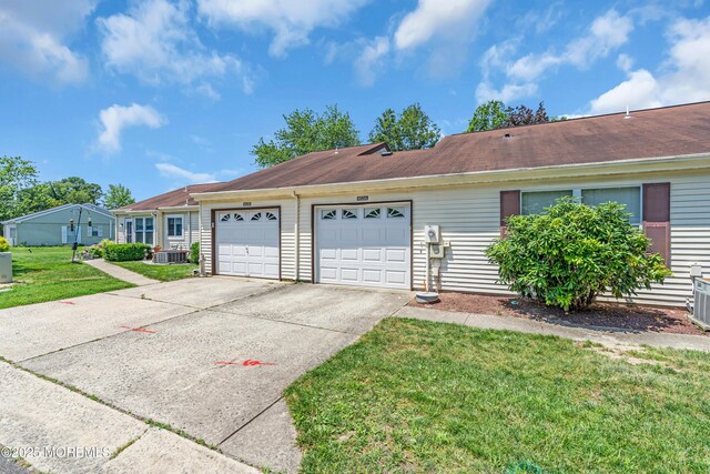 853 Winchester Ct Unit A, Manchester, NJ 08759 - ranch-style house featuring an attached garage, driveway, a front yard, and roof with shingles
