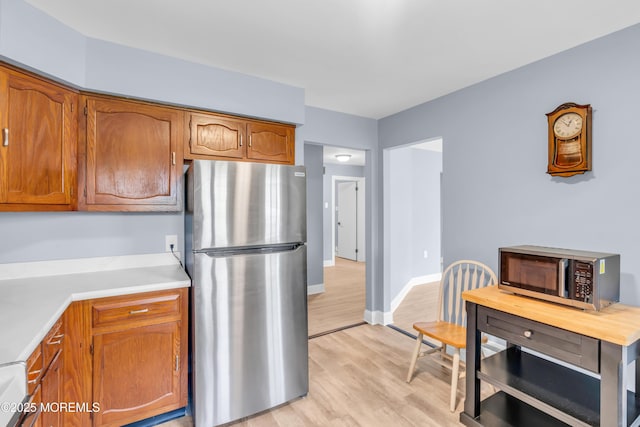 14A Portsmouth St, Whiting, NJ 08759 - kitchen with stainless steel appliances, light wood finished floors, light countertops, and brown cabinets